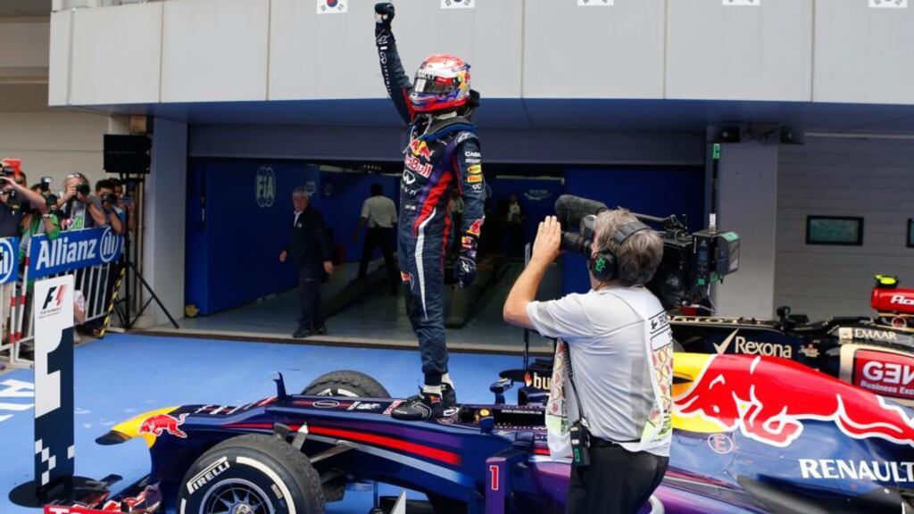 Red Bull Formula One driver Sebastian Vettel of Germany raises his fist atop his car after winning the Korean F1 Grand Prix in Yeongam. Kim Hong-Ji/Reuters