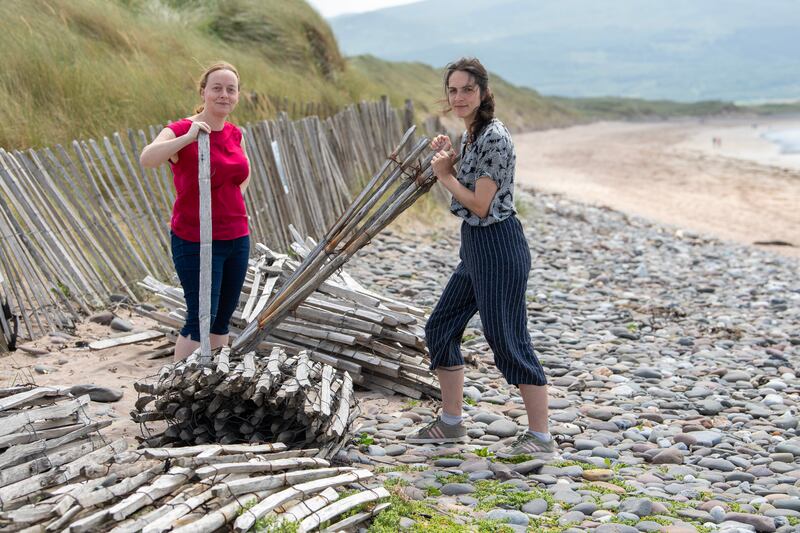 Locals Janne Spillane and Zoe Rush at work on the sand dunes. Photograph: Domnick Walsh