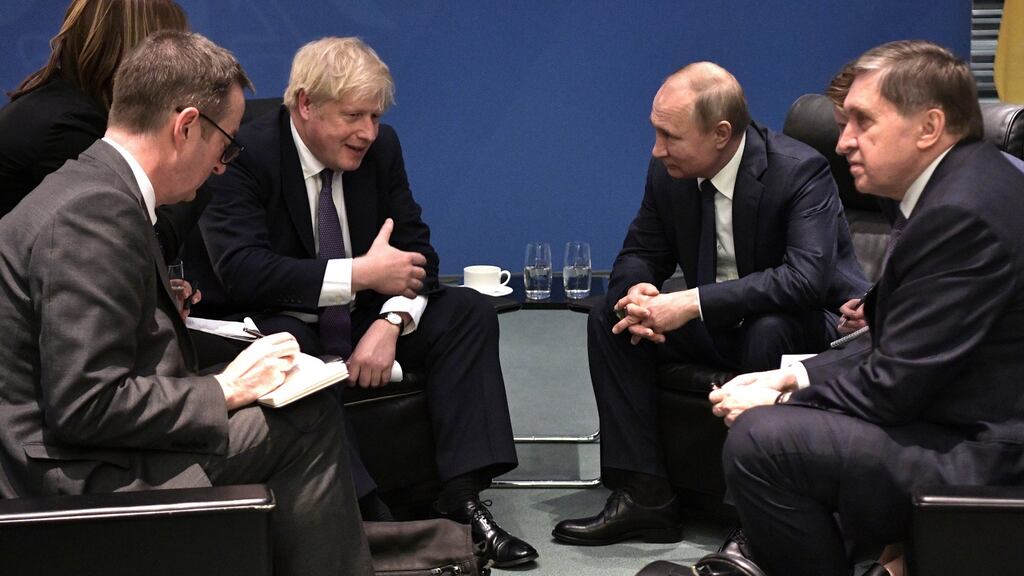 British prime minister Boris Johnson speaks with Russian president Vladimir Putin during the International Libya Conference in Berlin in January. Photograph: Alexei Nikolsky/ EPA/ Sputnik/ Kremlin