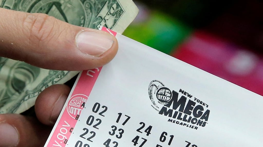 A ticket is sold ahead of the Mega Millions lottery draw in the US, which has bee won by a single ticket at $540 million. File photograph: Andrew Kelly/Reuters