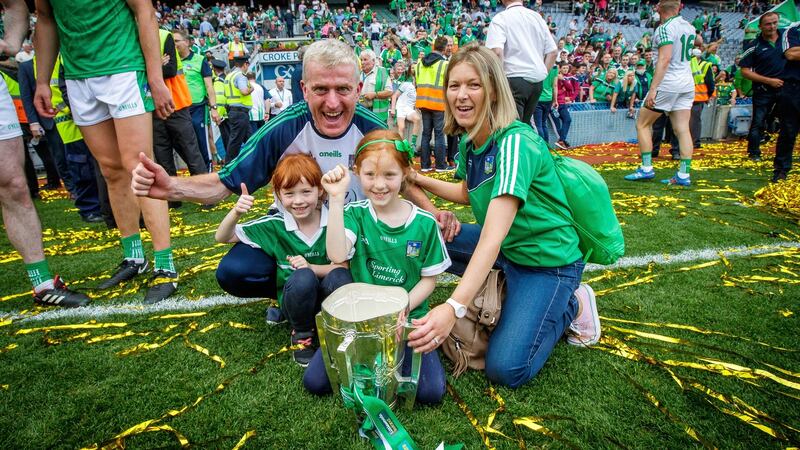 John Kiely and his family with the Liam MacCarthy cup. Photograph: Ryan Byrne/Inpho