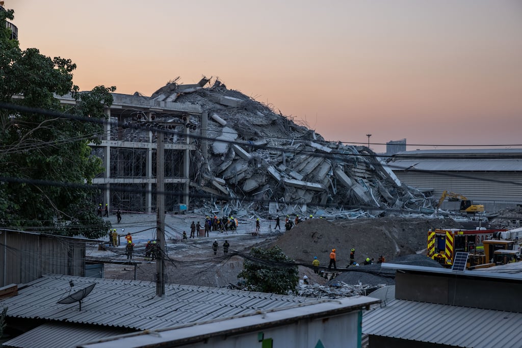Thai rescue teams provide aid at a construction building collapse in Bangkok's Chatuchak area. Photograph: Lauren Decicca/Getty Images