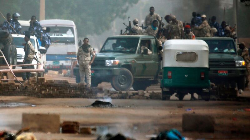 Sudanese forces around Khartoum’s army headquarters as they try to the break up the sit-in demonstration against the authorities. Photograph: Ashraf Shazly/AFP/Getty Images