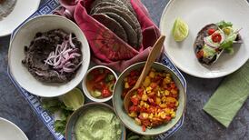 Delicious home-made corn tortillas with black beans and peppers
