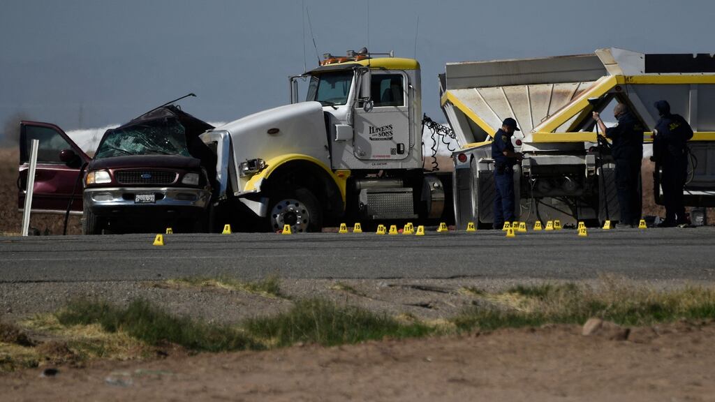 Investigators at the scene of a multi-fatality crash between an SUV and a heavy truck  near Holtville, California on Tuesday. Photograph: Patrick T Fallon/AFP/Getty