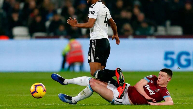 West Ham United’s Declan Rice tackles Fulham’s Denis Odoi. Photograph: Getty Images
