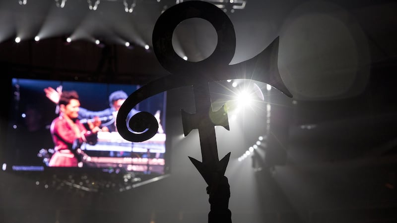 A Prince fan holds up his symbol at the Official Prince Tribute concert in St Paul, Minn, Oct. 13, 2016. Photograph: Ackerman + Gruber/The New York Times