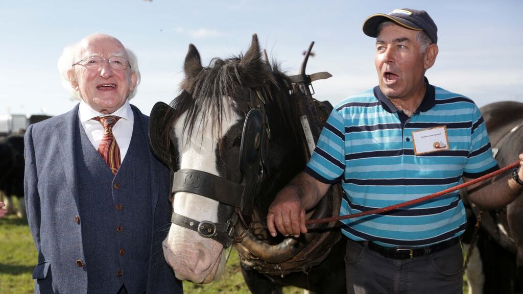 President Michael D Higgins pictured with William O’Connell from Macroom, Cork, at the under 40 horse plough competition on the opening day of the National Ploughing Championships in Screggan, Co Offaly. Photograph: Laura Hutton/Collins Agency