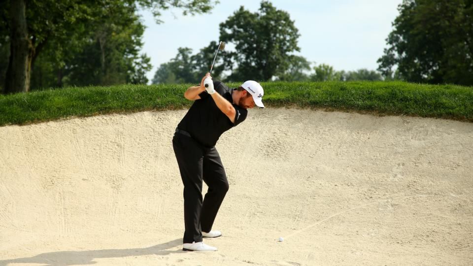 Shane Lowry of Ireland plays out of a bunker on the 14th hole during the final round of the World Golf Championships - Bridgestone Invitational at Firestone Country Club South Course. Photograph: Richard Heathcote/Getty Images