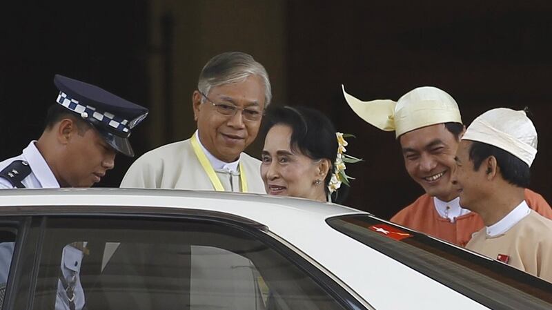 Myanmar’s newly elected president Htin Kyaw (second left) and National League for Democracy party leader Aung San Suu Kyi (centre) leave the parliament at Naypyitaw, Myanmar on Tuesday. Photograph: Getty