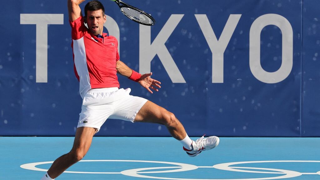 Novak Djokovic hits a return to Alejandro Davidovich Fokina Tokyo 2020 Olympic Games men’s singles third round match. Photo: Giuseppe Cacace/AFP via Getty Images