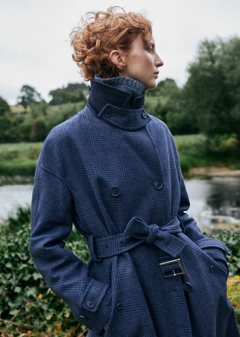 Navy double-breasted mac, €620, Triona