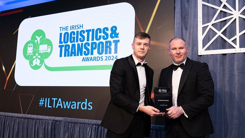 Eduard Tampu, senior recruitment consultant of Driving Force presents the 3PL achievement award to Robert Tumbleton, Ace Express Freight