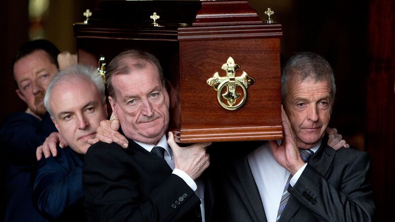 The coffin of Fr Eoghan Haughey is carried out of the Mary Immaculate Church on Tyrconnell Road, Inchicore on Monday by Ciaran Haughey(front left). Photograph: Tom Honan.