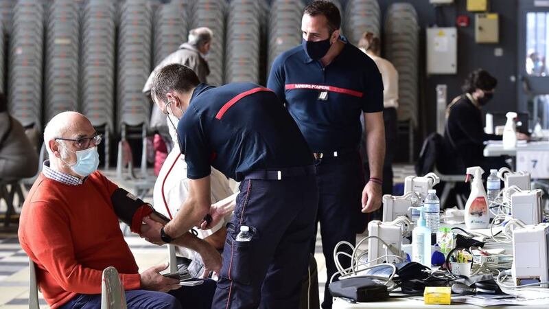 Firefighters conduct health check-ups in a temporary vaccination centre in the Parc des Expositions, Toulouse: Photograph: Georges Gobet