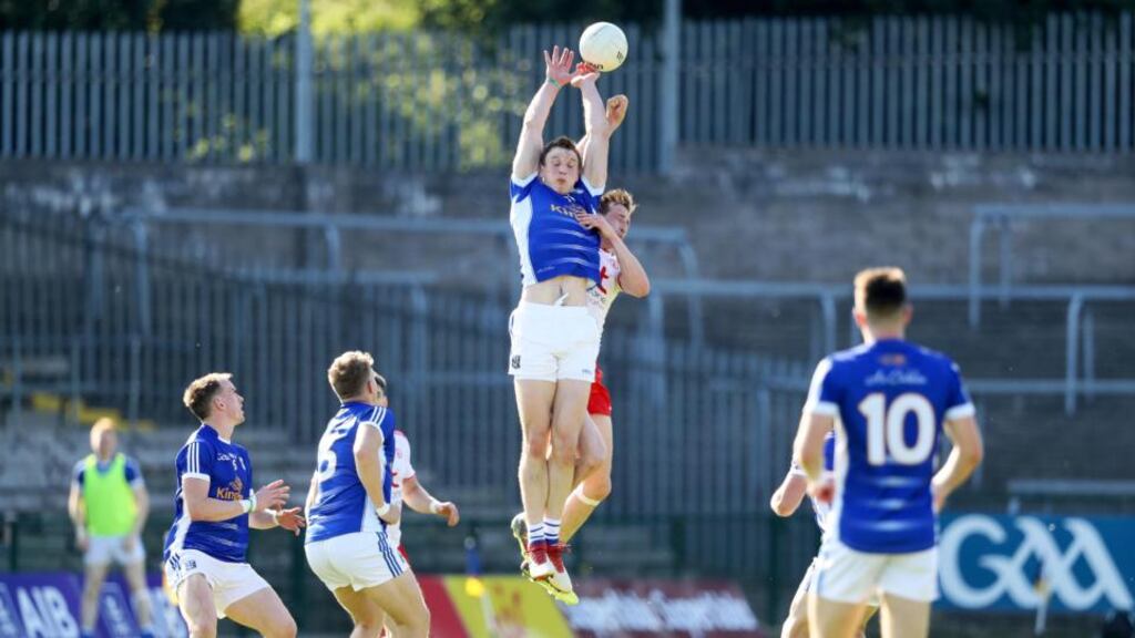 Tyrone’s Colm Cavanagh challenges Gearoid McKiernan for a high ball. Photograph: Tommy Dickson/Inpho