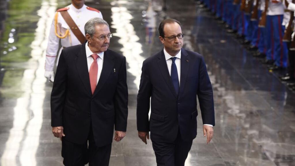 French president Francois Hollande (right) and Cuban president Raul Castro Ruiz review a guard of honour at the Revolution Palace in Havana. Photograph: Alain Jkocardalain/AFP/Getty Images