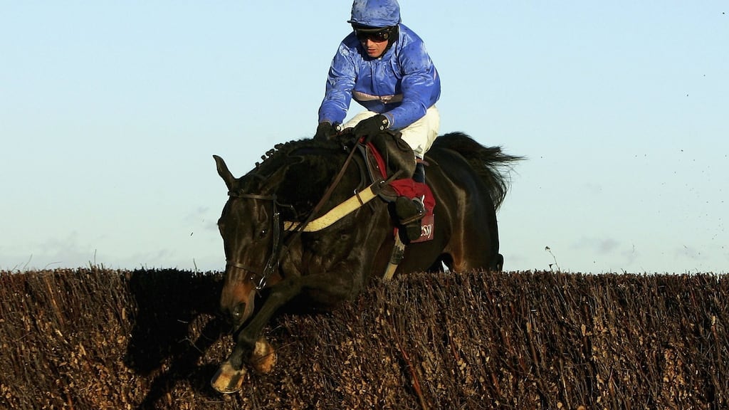 Paul Moloney and State of Play jump the last fence before landing The Hennessy Cognac Gold Cup Steeple Chase Race run at Newbury Racecourse in 2006. Photograph: Getty Images