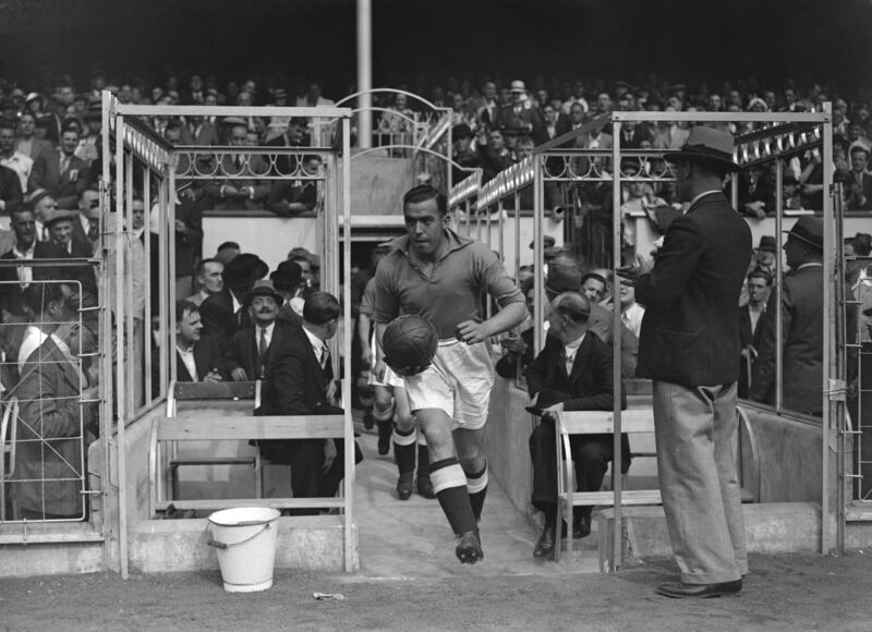 Dixie Dean leads out Everton for a match against Arsenal FC at Highbury in London. He helped Everton to two league titles and one FA Cup win. Photograph: Barker/Getty Images