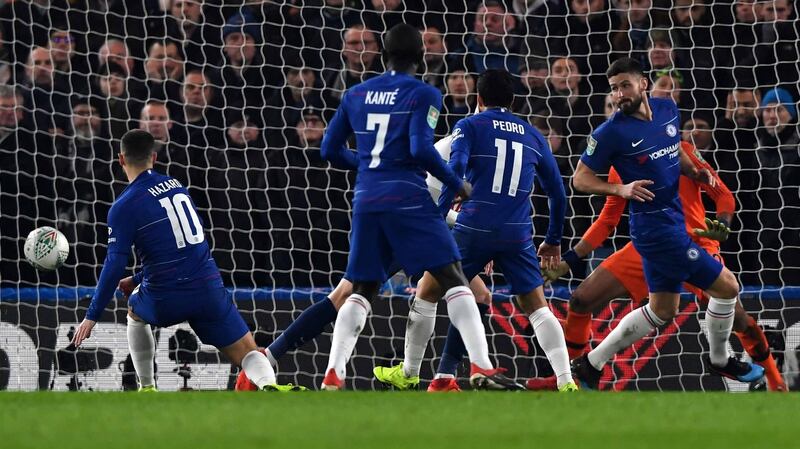 Chelsea’s Eden Hazard scores to put his side 2-0 up. Photo: Neil Hall/EPA
