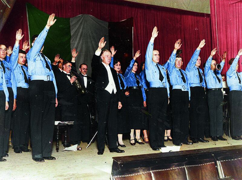 Roman salute while the hymn of the Blueshirts movement plays in Mansion House in November 1934. Photograph: National Digital Archive, Poland from Old Ireland in Colour 2