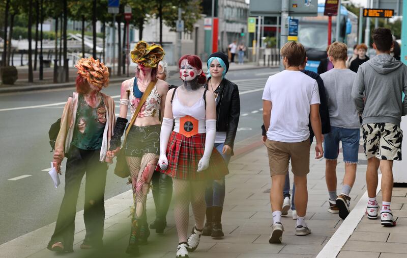 Lucy White, Bella Hogan-Hickey, Emily White and Hannah White, from Wexford, make their way to Comic Con. Photograph: Dara Mac Dónaill