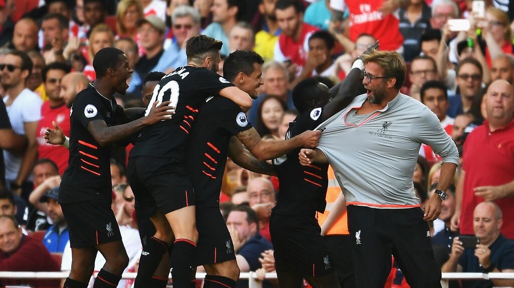Sadio Mane and his Liverpool team mates celebrate with Jurgen Klopp during their team’s victory over Arsenal. Photograph: Mike Hewitt/Getty Images