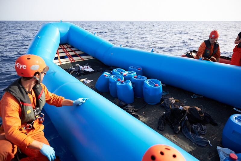 Rescuers inspect the inflatable boat used by migrants off the Libyan coast on July 5th. Photograph: Fabian Heinz/Sea-Eye Handout/EPA