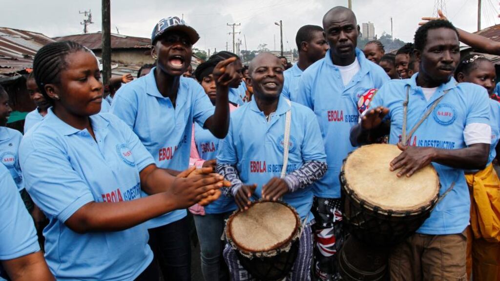 Liberians leading an awareness campaign about the deadly Ebola virus in Monrovia. An epidemic is raging in Guinea, Sierra Leone and Liberia, and has spread into Nigeria and Senegal. Photograph: Ahmed Jallanzo/EPA
