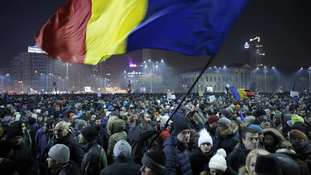 Protesters gather in front of government headquarters in Bucharest, Romania: More than 250,000 people took to the streets on Wednesday to voice disapproval of a decree decriminalising a number of graft offences. Photograph: Robert Ghement/EPA