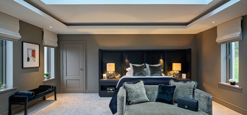 More muted colours were chosen for the big-ticket items, while introducing colour in cushions and throws. Photograph: Gareth Byrne