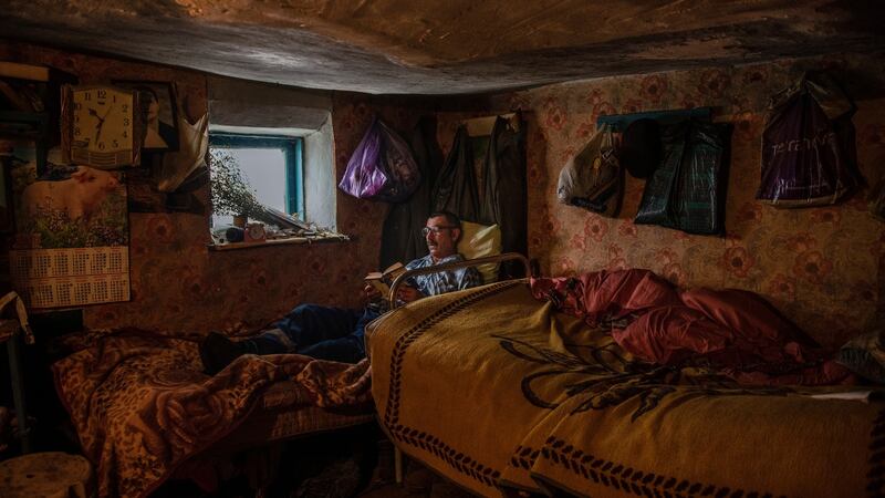 Grisa Muntean, who lives alone in the village of Dobrusa, Moldova, following the murder of its last two residents. ‘The loneliness kills you.’ Photograph: Laetitia Vancon/The New York Times