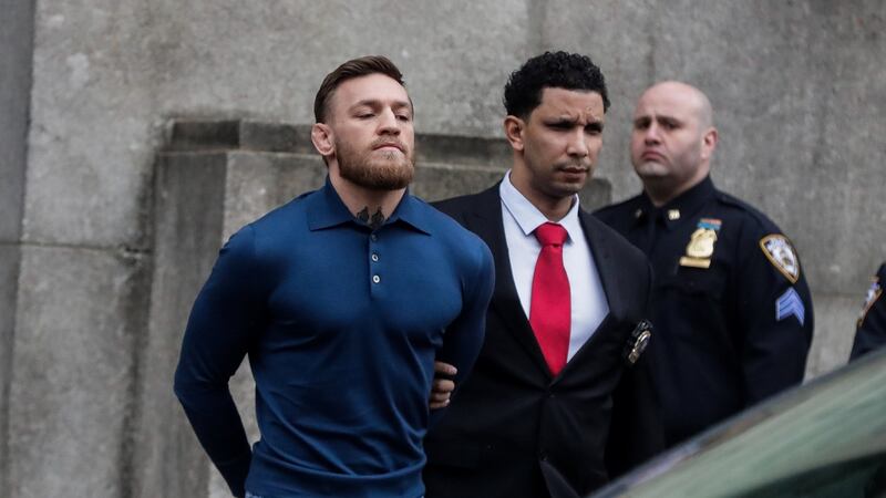 MMA fighter Conor McGregor walks out of the 78th police precinct after charges were laid against him following a late night melee in the Brooklyn borough of New York City. Photograph:  Jeenah Moon/Reuters