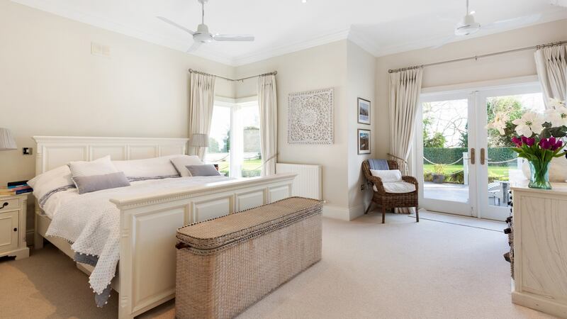 Bedroom with doors to patio