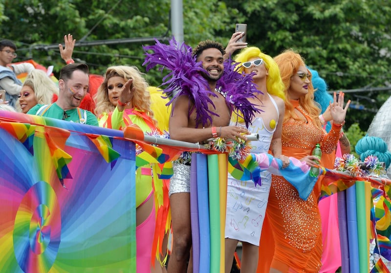 LIVING IT LARGE: Kings and queens of Pride float along in Dublin city centre. Photograph: Alan Betson
