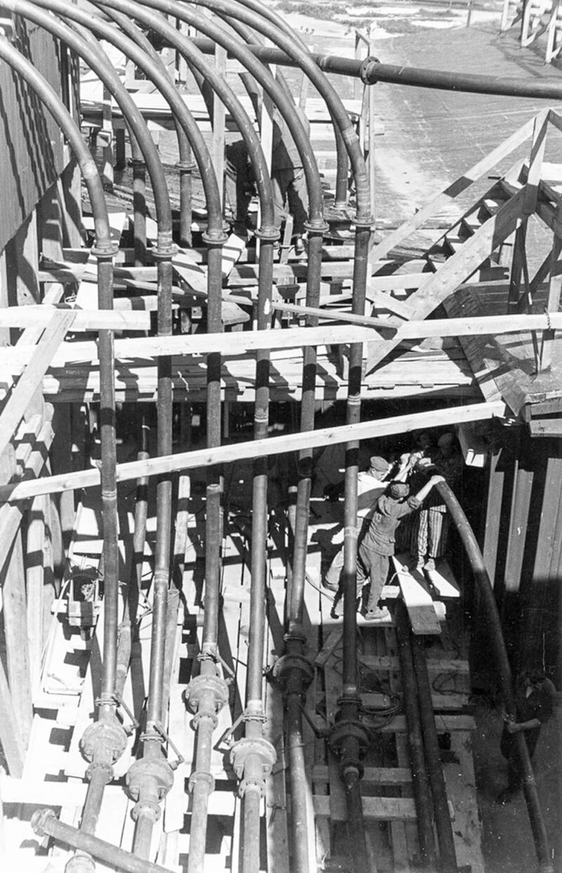 An official photograph showing prisoners working on the construction of Bunker Valentin during the second World War