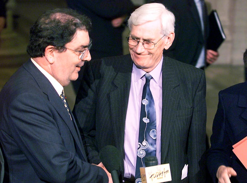 John Hume and Seamus Mallon shake hands at the end of the elections of Ministers to the Northern Ireland Assembly at Stormont. Photograph: Alan Betson