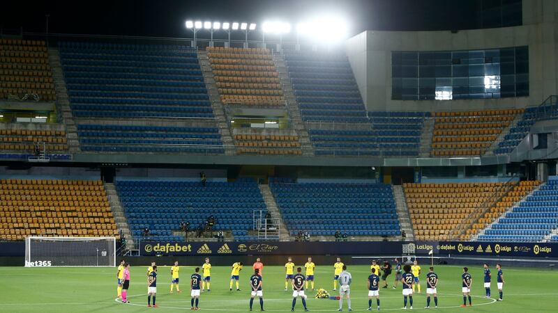 Cadiz and Osasuna players observe a minute silence in respect to Covid-19 victims prior to the La Liga match at Estadio Ramon de Carranza in Cadiz. Photograph: Fran Santiago/Getty Images