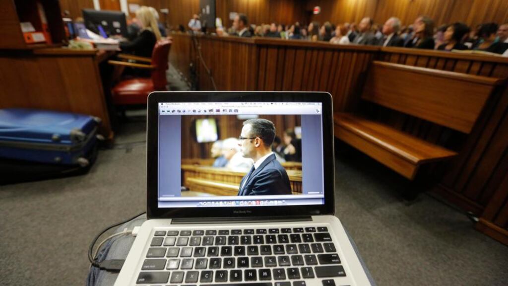 A photograph of South African Paralympic athlete Oscar Pistorius is displayed on the laptop of a court pool photographer during his ongoing murder trial in Pretoria. Photograph: EPA