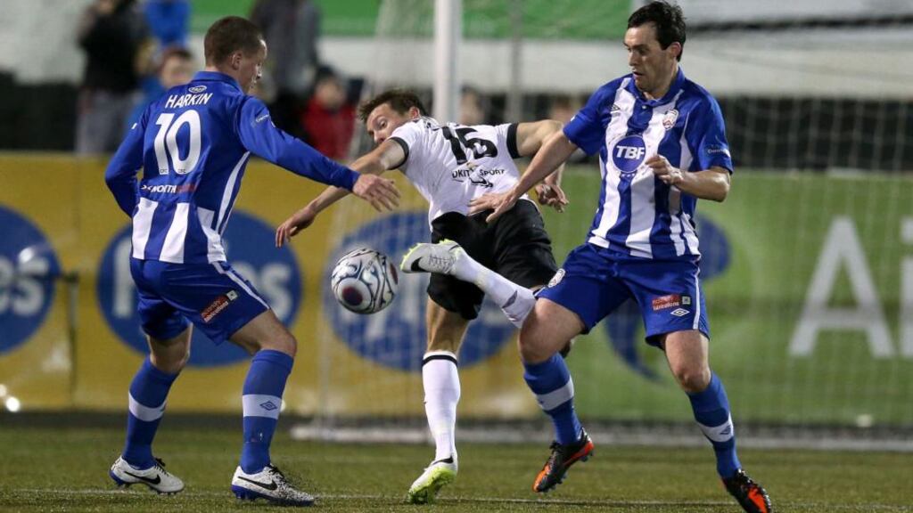 Coleraine’s Ruairi Harkin and Michael Hegarty with David McMillan (centre )of Dundalk. Photograph: Dan Sheridan/Inpho