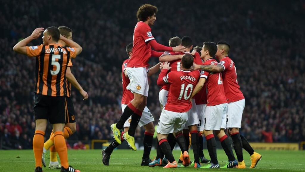 Manchester United’s Chris Smalling is mobbed by his team-mates after his scrambled goal put his side 1-0 up against Hull City at Old Trafford
