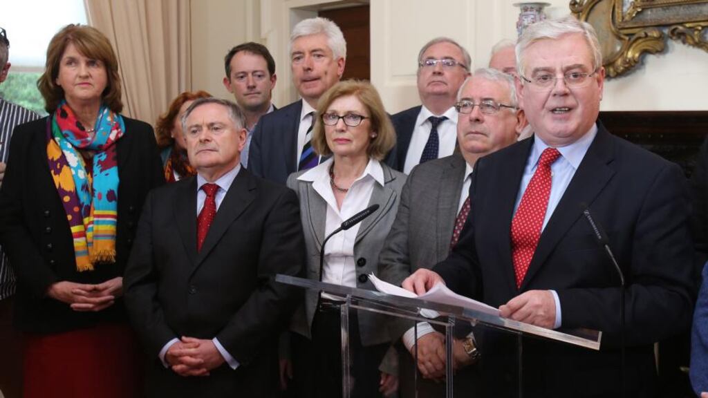 ‘There has to be a change’: Eamon Gilmore announces his resignation as the leader of the Labour Party on Monday. Photograph: Niall Carson/PA