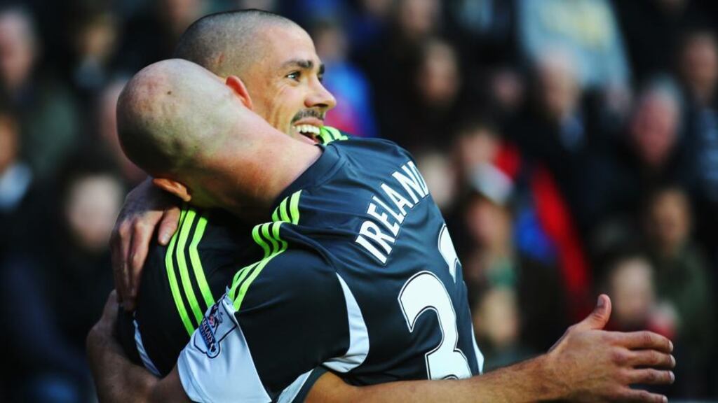 Jonathan Walters of Stoke City is congratulated by team-mate Stephen Ireland after scoring the opening goal during the Premier League match against Swansea City at the Liberty Stadium. Photograph: Clive Rose/Getty Images