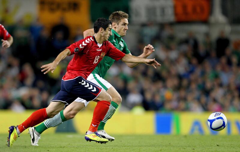 Henrikh Mkhitaryan goes up against Ireland's Kevin Doyle in a Euro 2012 qualifier. Photograph: Lorraine O'Sullivan/Inpho