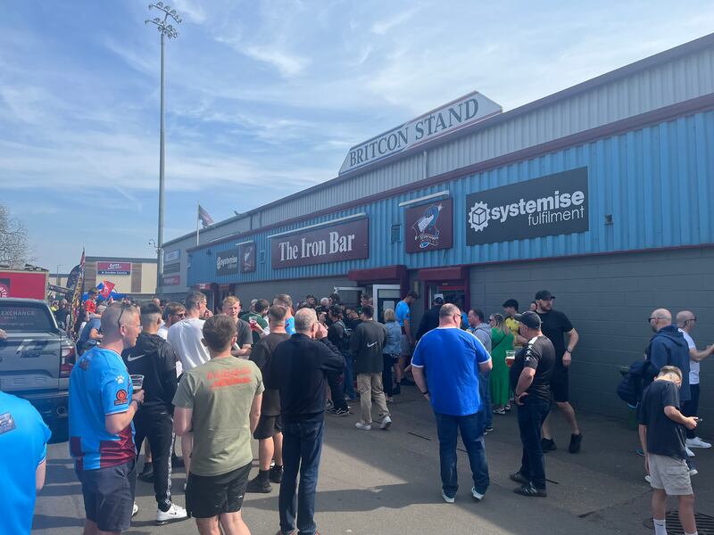 Scunthorpe United supporters drinking in the sunshine outside Glanford Park. Photograph: Mark Paul