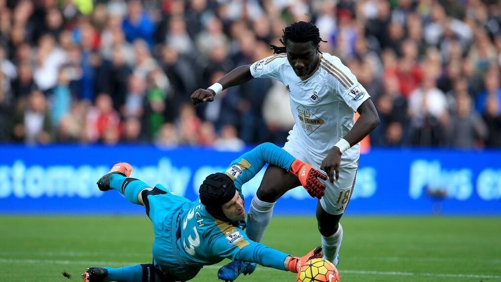 Petr Cech of Arsenal saves at the feet Swansea’s of Bafetimbi Gomis during the Premier League at the Liberty Stadium. Photograph: Ben Hoskins/Getty Images.
