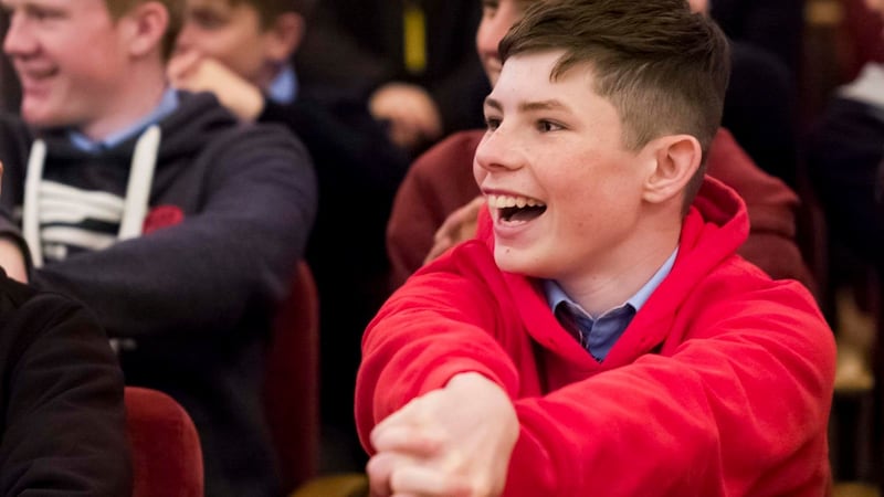 Robert Coffey from St Aidens CBS tries out one of the hand puzzles as he listens to James Tanton talking about maths at the RDS. Photograph: John T Ohle