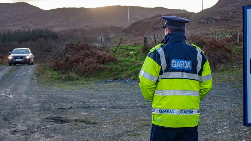 A Garda standing at the entrance to the Windmill site near Kerrykeel in North Donegal, where the search is being undertaken. Photograph: North West Newspix