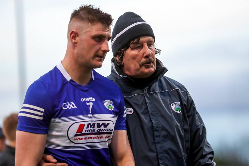 Laois manager Seamus Plunkett with Ryan Mullaney after Leinster Senior Hurling Championship. Photograph: Ben Whitley/Inpho