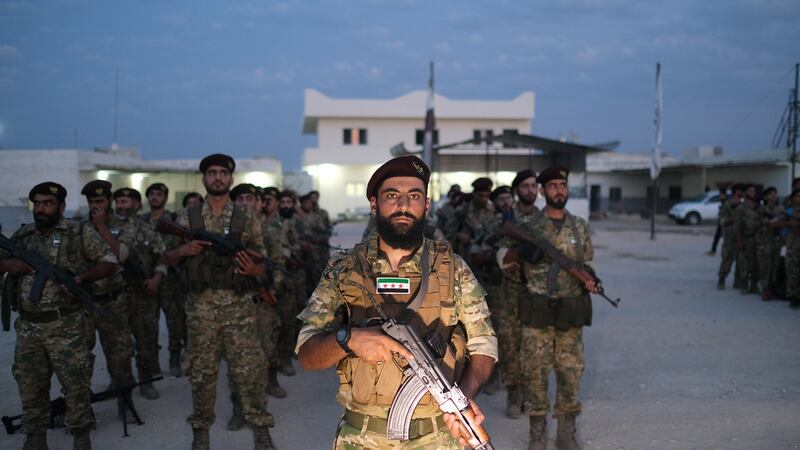 Turkey-backed members of Syrian National Army prepare for moving to Turkey for an expected military operation into Kurdish areas of northern Syria, in Azas, Syria. Photograph: EPA